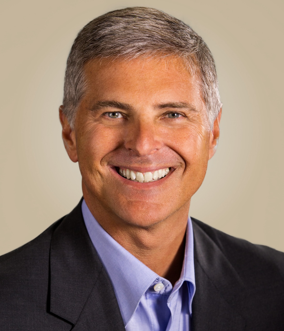 Smiling man, close up, suit and purple shirt